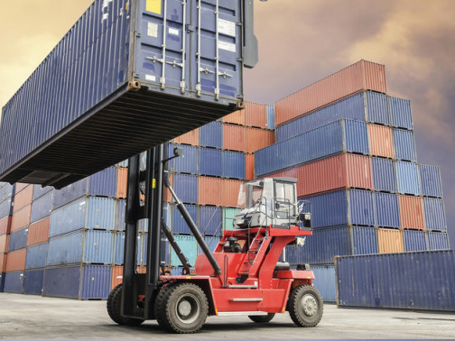 Forklift handling shipping containers