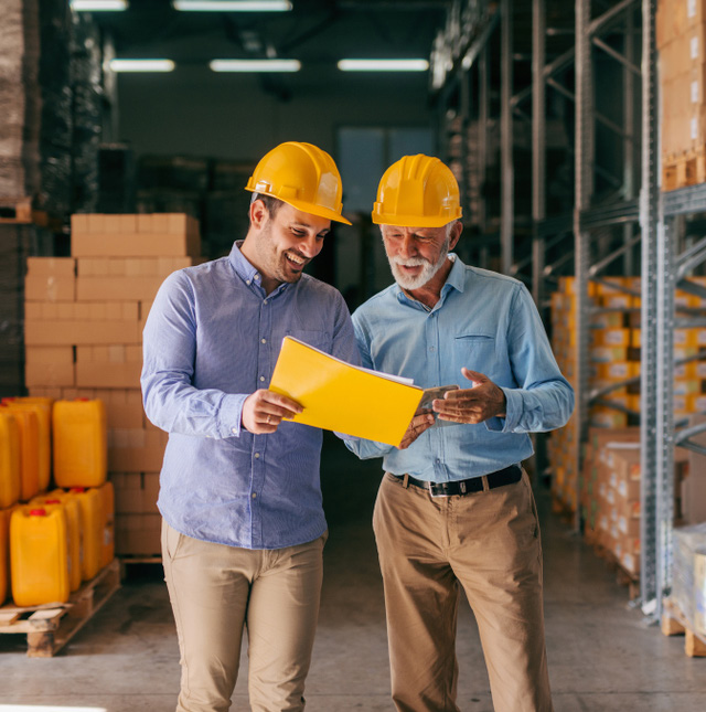 Omkar Enterprise team reviewing operations in a warehouse